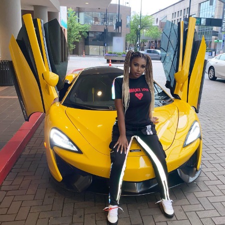 Deiondra Sanders flexing her Mclaren. 